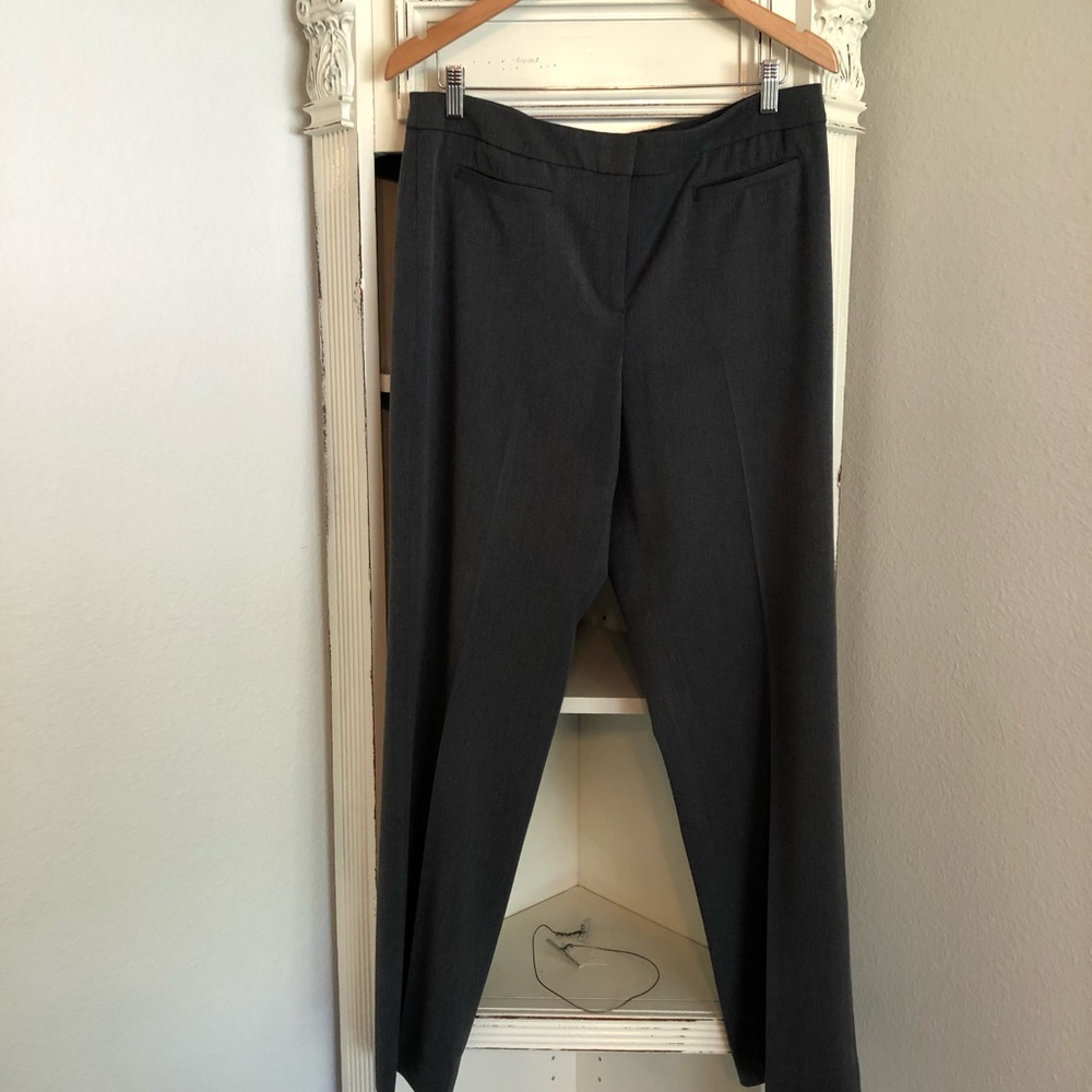 Anne Klein stretch.  Front pockets still sealed, no rear pockets for clean look.